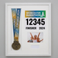 a framed collage of a medal, a photo of three people, and a sign for the Worcestershire Marathon.
