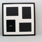 a black and white picture frame with four squares