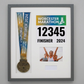 a framed collage of a medal, a photo of three people, and a race number.