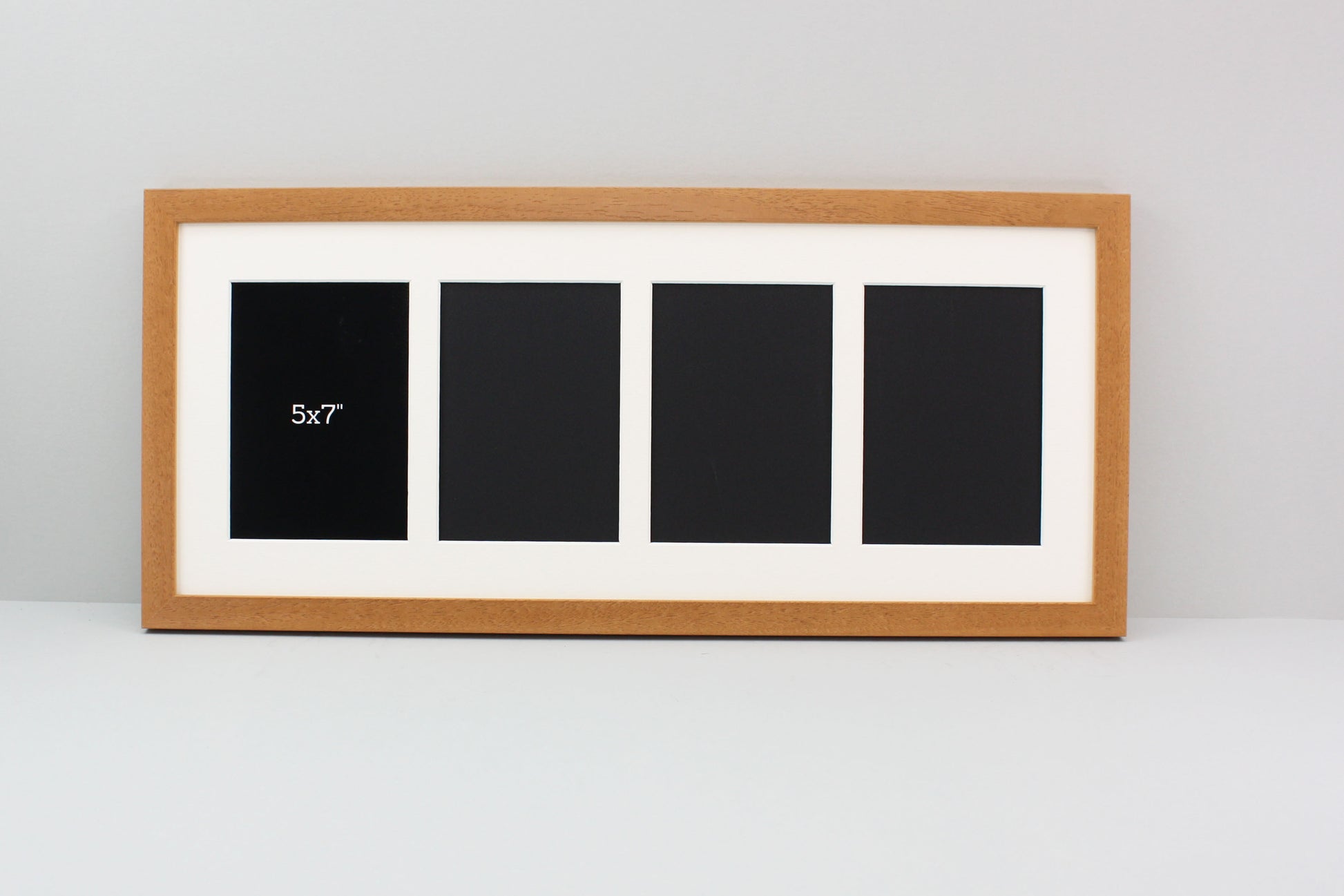 a picture frame with a picture of three black squares