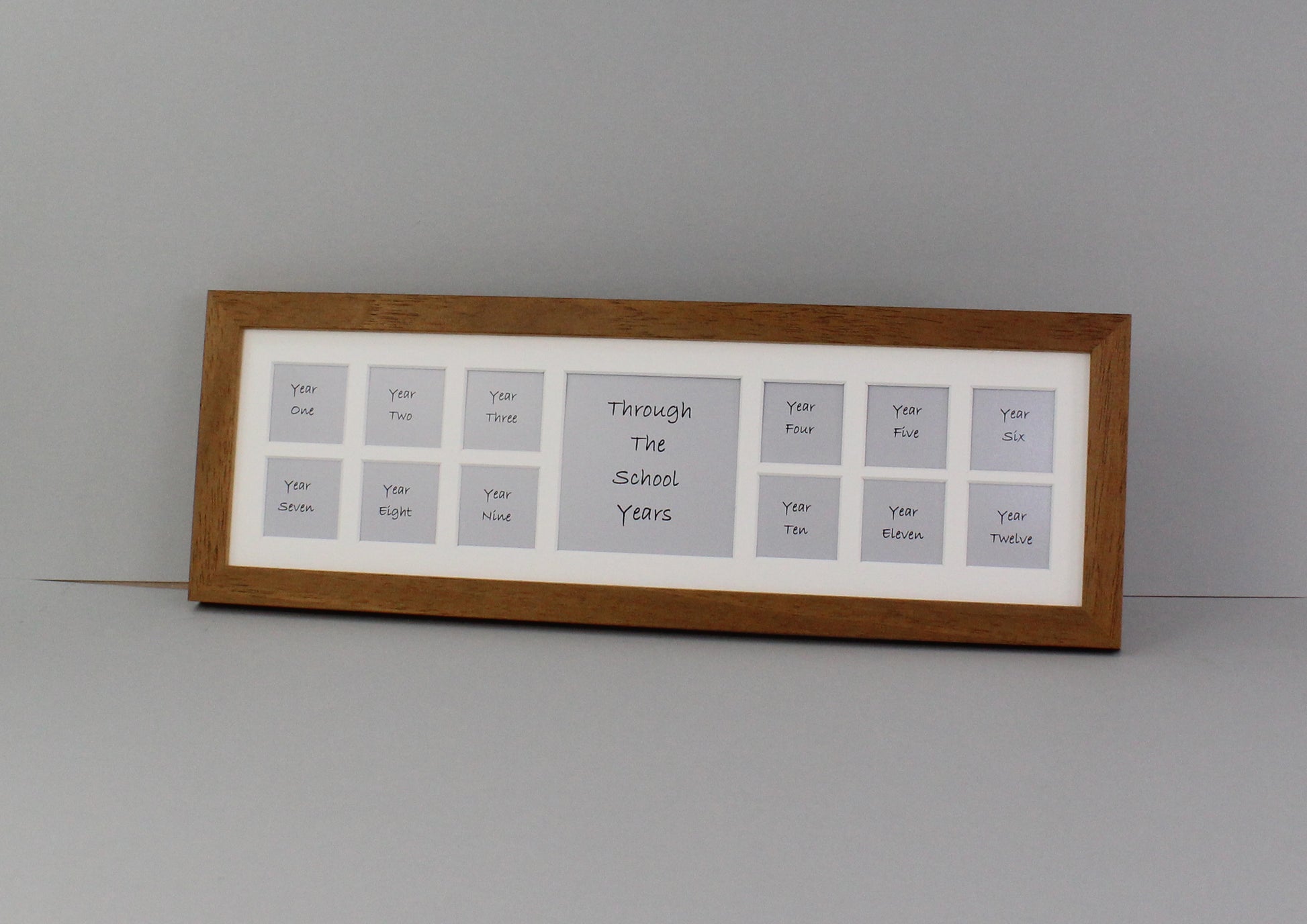 Through School Years Photo Frame - Multi Aperture Frame. 15x50cm. Small wooden multi aperture photo frame to display 12 2x2inch pictures of your child's school years. - PhotoFramesandMore - Wooden Picture Frames