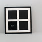 a black and white picture frame with four squares