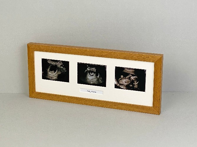 Oak Frame with three sonogram sized apertures for Baby Scans, with text box.