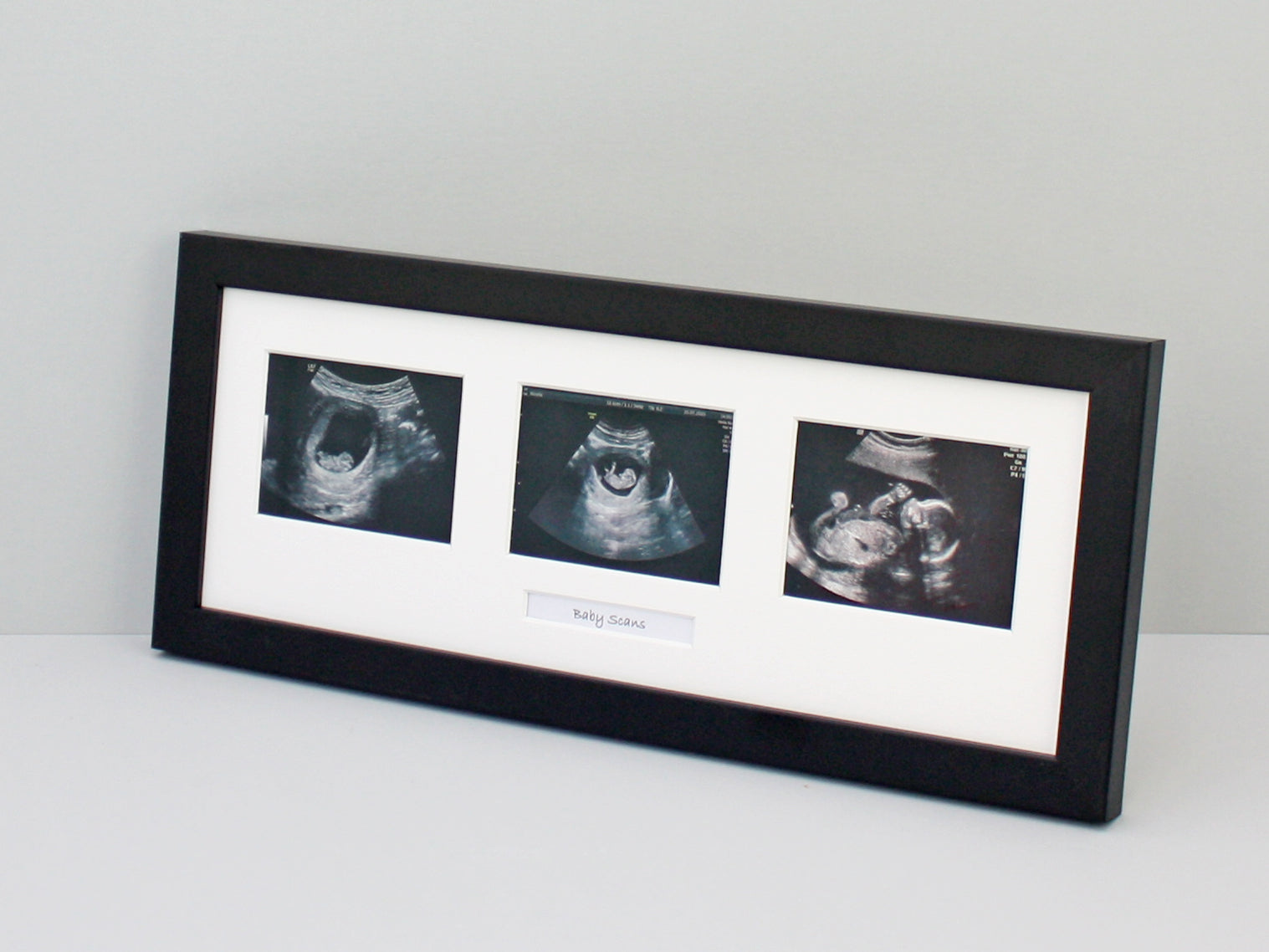 Black Frame to suit three baby scans with text box.